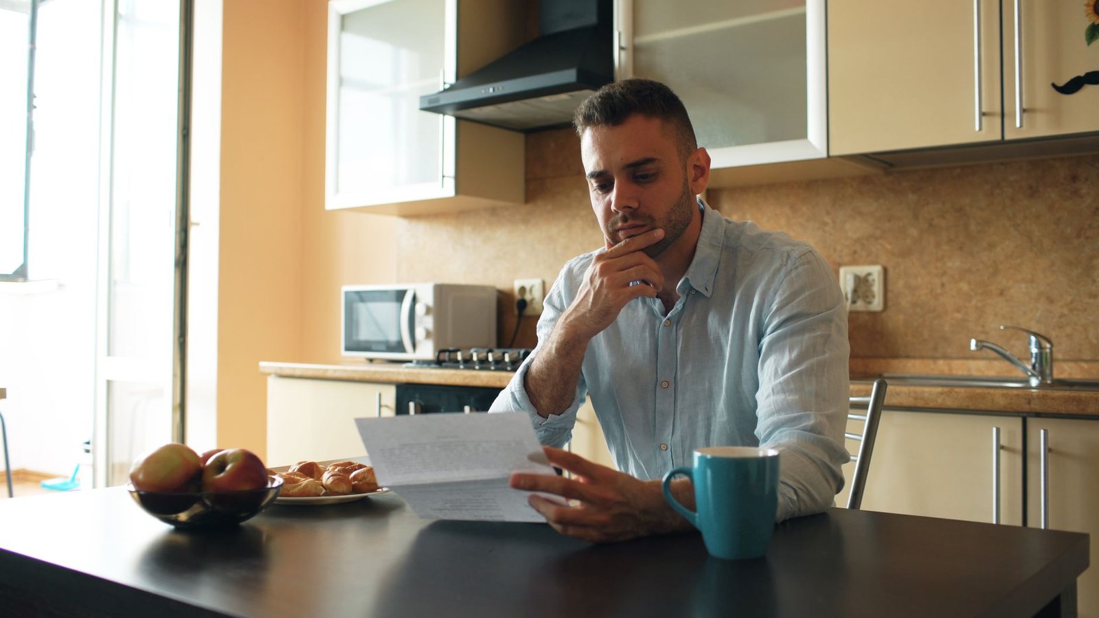 Person highlighting a letter after a long term disability claim denied decision