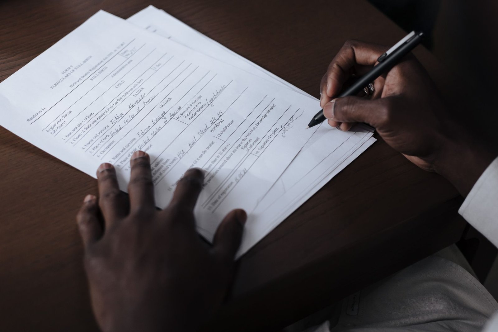 Person at a desk reviewing tax forms and a disability benefit statement